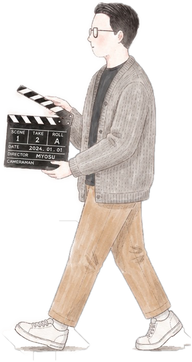 A man walking with a clapperboard.